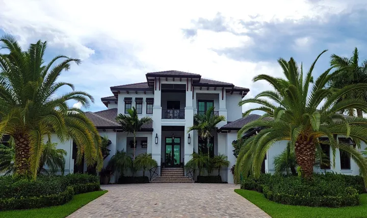 Residential home with palm trees, water heater installation Gateway Fort Myers