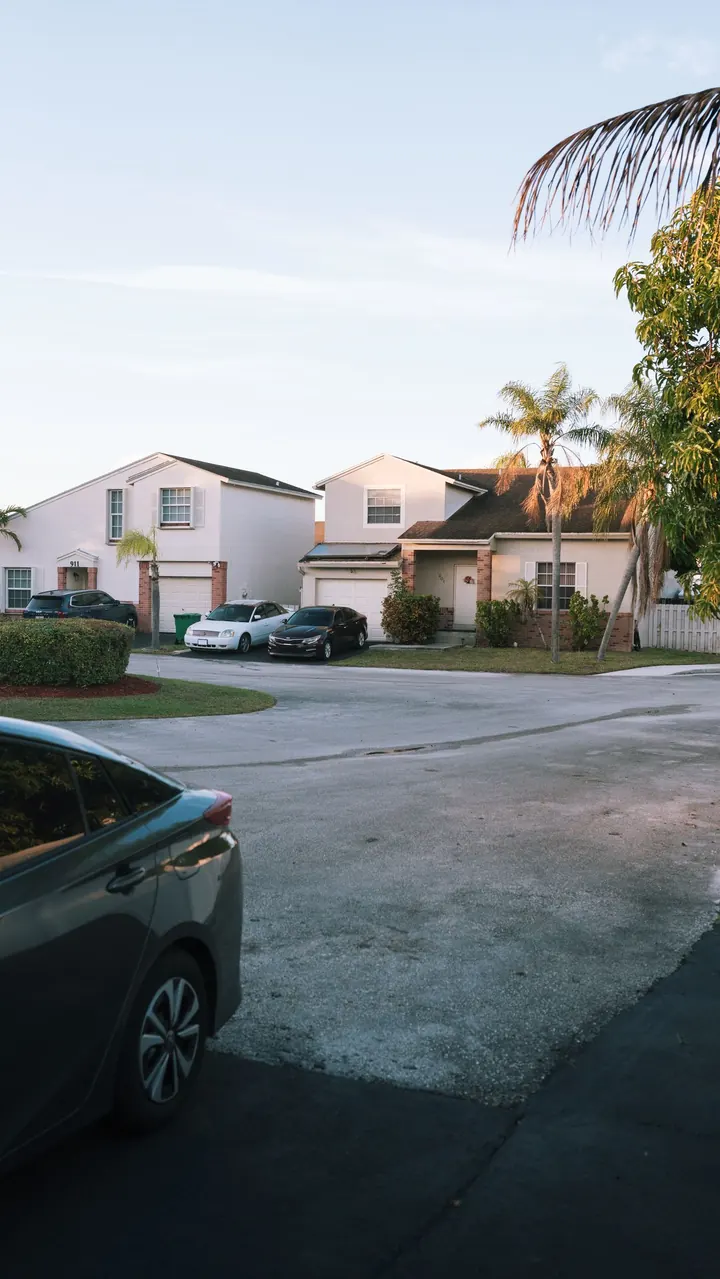 Residential street with palm trees in Southwest Florida, water heater installation Fort Myers