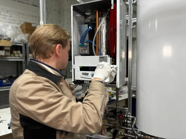 Technician servicing a heating system, water heater installation Fort Myers